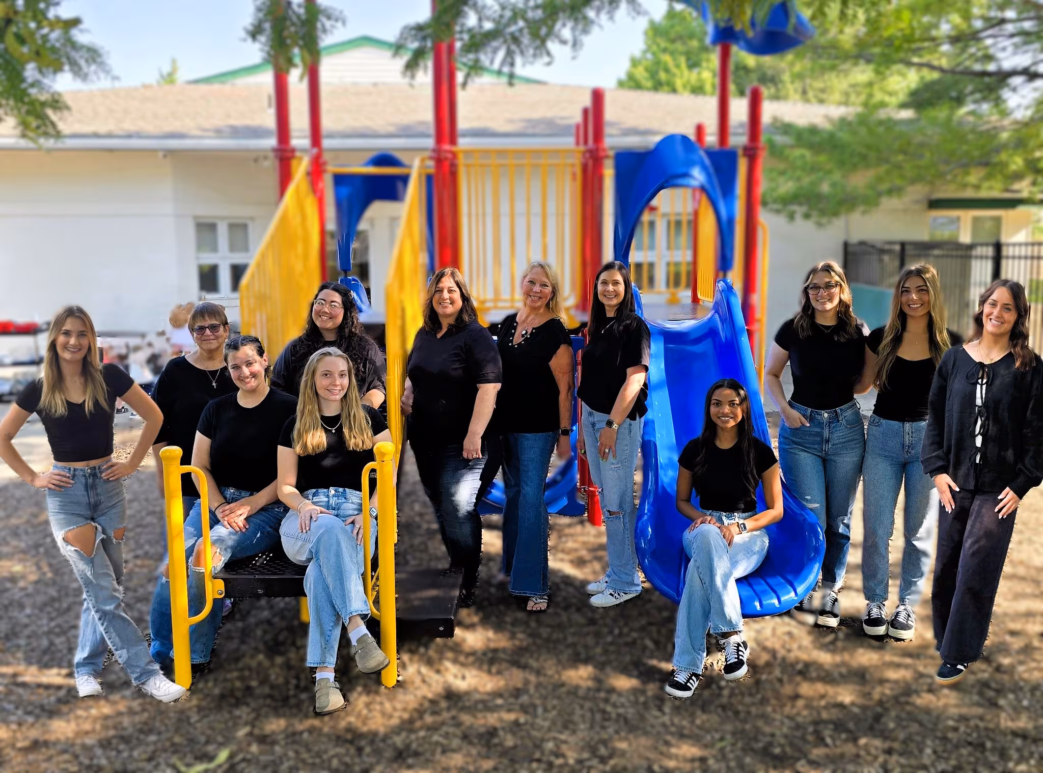 The Building Blocks Preschool team together outdoors